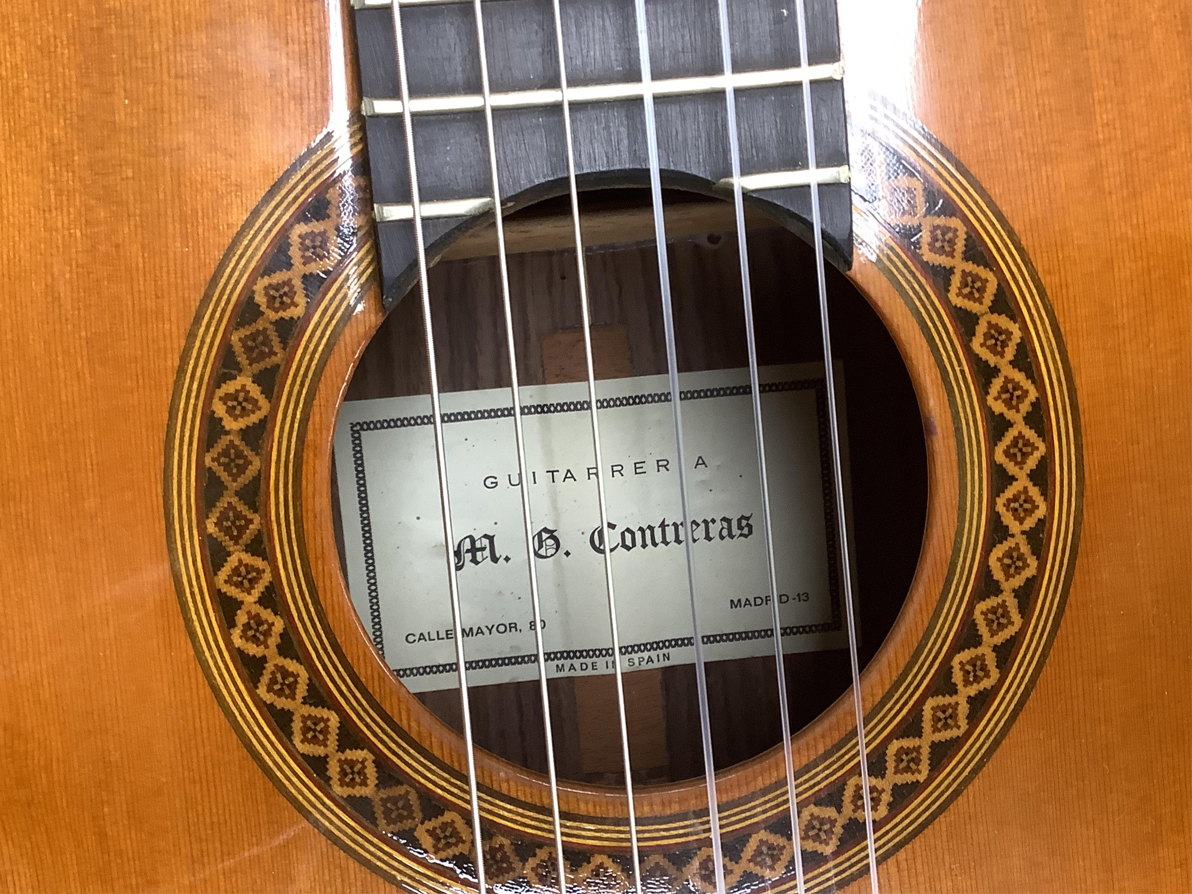 A Spanish Manuel Contreras classical guitar, with cedar front, Indian rosewood back sides and ebony fingerboard, with makers label inside body; M.G. Contreras, Madrid, back 49cm